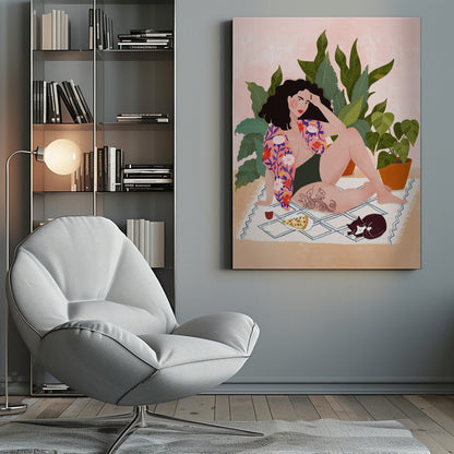 An illustration of a woman with dark curly hair relaxing on a patterned blanket indoors. She is wearing a green swimsuit and a pink floral shirt, with a prominent snake tattoo on her thigh. Next to her is a slice of pizza, a glass of red wine, and a sleeping black and white cat, all set against a backdrop of large green houseplants and a pink wall. Artwork