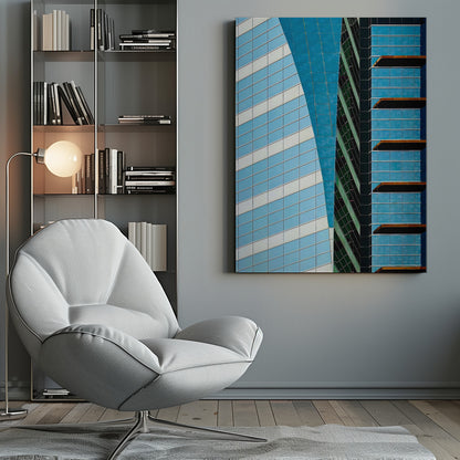 An abstract close-up photograph of modern skyscrapers, featuring a dynamic composition of intersecting lines and geometric patterns. The facades consist of blue, white, and dark green reflective glass, creating a visually complex play of light, shadow, and color. Wall Art
