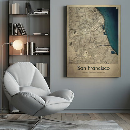 A framed vintage map of San Francisco from 1900. The map is detailed on aged, beige paper, with the bay depicted in a deep teal blue. Below the map, text reads 'San Francisco' and 'California of United States of America in 1900'. Artwork