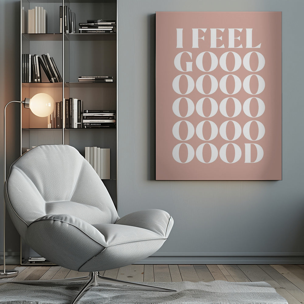 A framed typographic poster featuring the words 'I FEEL GOOOOOD' in a large, white serif font against a dusty pink background. The word 'GOOD' is stylized and stretched vertically with multiple rows of the letter 'O'. Artwork