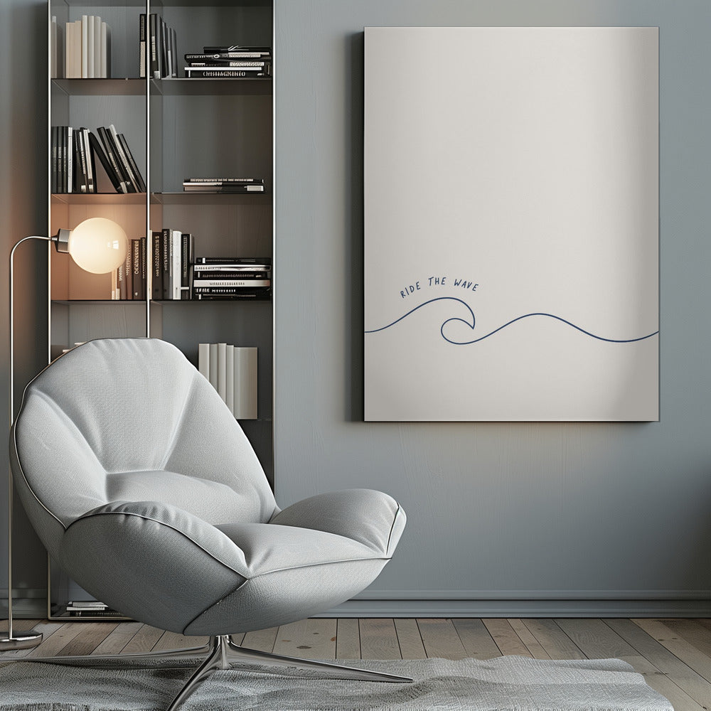 A minimalist art print in a black frame featuring a single dark blue line that forms a simple ocean wave on an off-white background. The words 'RIDE THE WAVE' are written in a casual, handwritten font above the crest. Wall Art