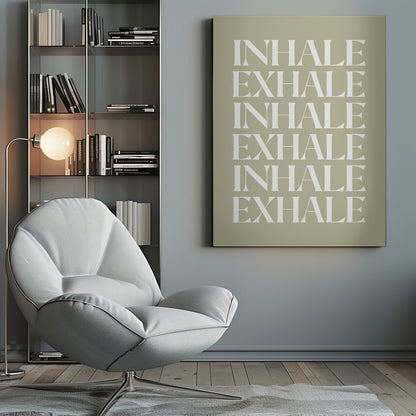 A minimalist art print featuring the words 'INHALE' and 'EXHALE' repeated in a vertical column. The text is in a bold, white serif font against a calming sage green background, all enclosed in a simple black frame. Print