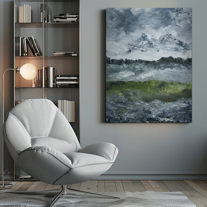 A heavily textured impasto painting of a dramatic mountain landscape under a stormy grey and white sky. Snow-capped peaks rise in the distance above a dark treeline, while a vibrant green field in the foreground provides a splash of color against the otherwise moody, cool-toned scene. The artwork is presented in a simple black frame. Wall Art