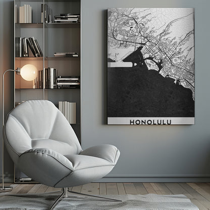 A framed, minimalist black and white map of Honolulu, Hawaii. The city's streets and coastline are rendered in black lines on a white background, while the ocean is a solid, textured black. The word 'HONOLULU' is printed in black sans-serif font at the bottom. Artwork