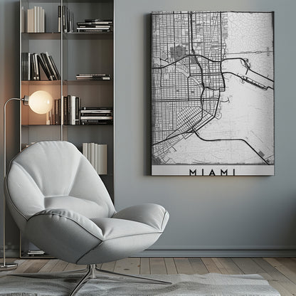 A minimalist black and white street map of Miami, Florida, with a distressed, textured background. The map is framed in black with the word 'MIAMI' printed in bold capital letters at the bottom. Artwork