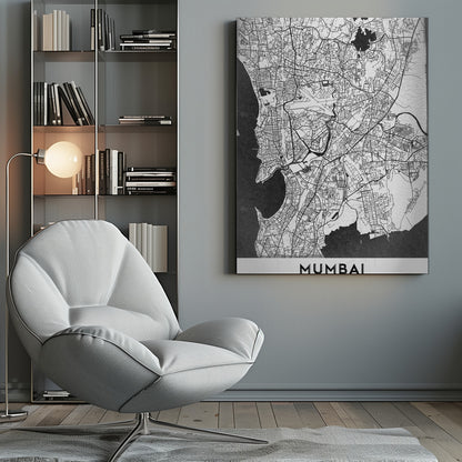 A minimalist black and white framed map of Mumbai. The city's intricate road network is depicted in black lines on a white background, with surrounding water bodies shown in a textured dark grey. The name 'MUMBAI' is in bold, uppercase letters at the bottom. Print