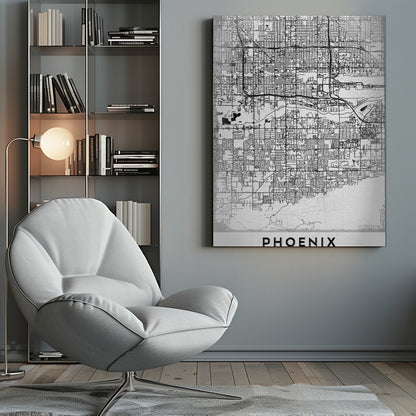 A minimalist black and white street map of Phoenix, Arizona, presented in a black frame. The map features a dense grid of roads on a lightly textured white background, with the city's name 'PHOENIX' printed in large, black capital letters at the bottom. Wall Art