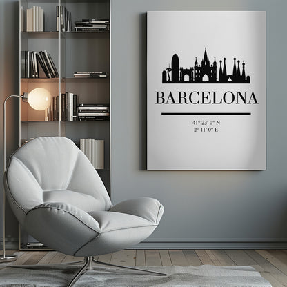 A minimalist black and white poster of Barcelona, Spain. It features a black silhouette of the city's skyline, including the Sagrada Familia, above the word 'BARCELONA' in a large serif font. Below the city name are its geographical coordinates, all set against a clean white background and framed in black. Print