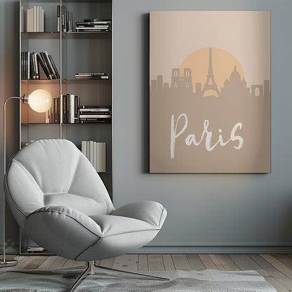 A minimalist art print of the Paris skyline in muted tan and beige tones. Silhouettes of the Eiffel Tower and other landmarks stand before a large, pale orange sun. The word 'Paris' is written in a white, flowing script in the foreground. Artwork