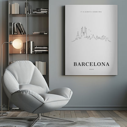 A minimalist black and white poster in a black frame featuring a single-line drawing of the Barcelona skyline. Above the skyline is the text 'IT IS ALWAYS A GOOD IDEA' and below it, the word 'BARCELONA' in large, bold letters with 'SPAIN' underneath. Artwork