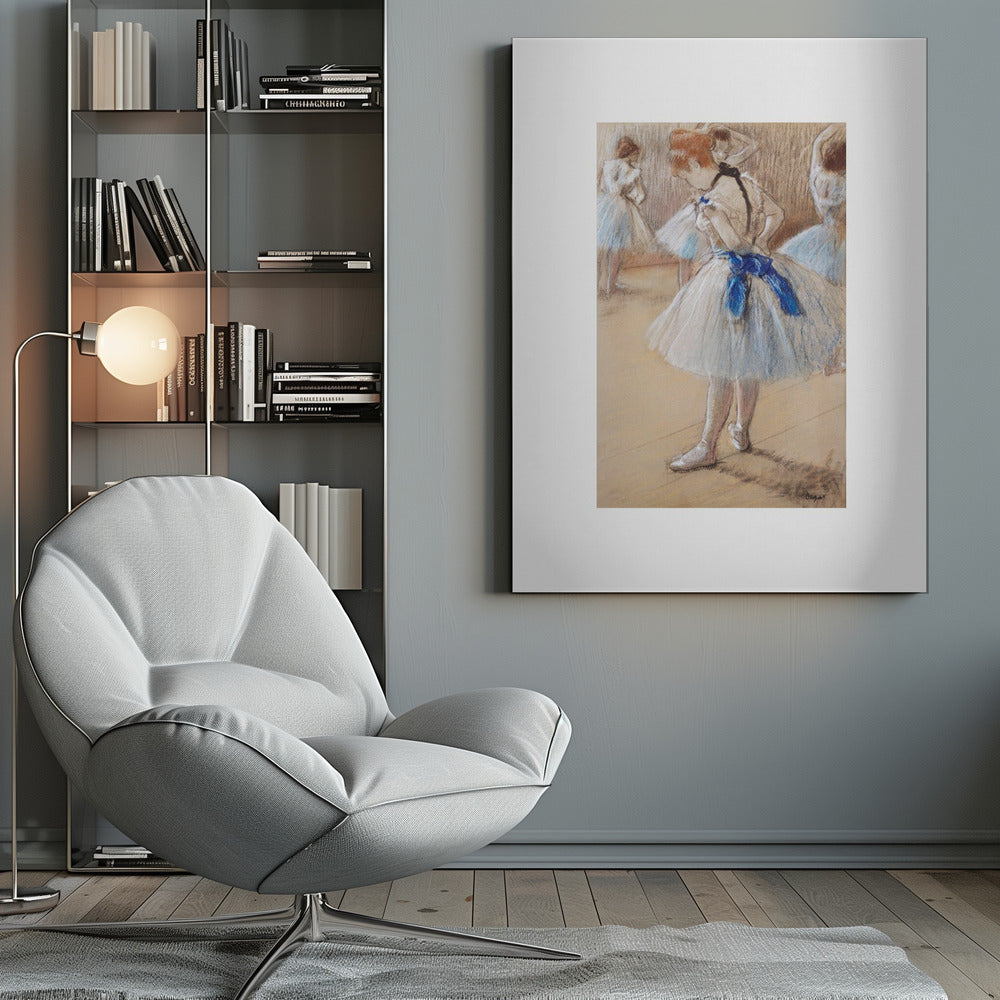A framed print of an impressionist pastel drawing by Edgar Degas. It shows a ballerina in a white and light blue tutu with a prominent royal blue sash. She is viewed from the side as she adjusts her costume, with other dancers blurred in the background of a dance studio. Poster