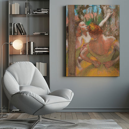 An Impressionist pastel drawing by Edgar Degas depicting several ballet dancers backstage. A dancer with reddish-orange hair is seen from behind in a yellow-green costume, while another dancer stretches an arm upwards. The background is a textured blend of blue, pink, and green. Decor