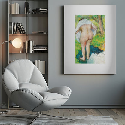 A framed pastel artwork by Edgar Degas showing the back of a nude woman as she dries herself with a white towel in a lush green landscape. The impressionist style is evident in the soft, textured application of color. Artwork