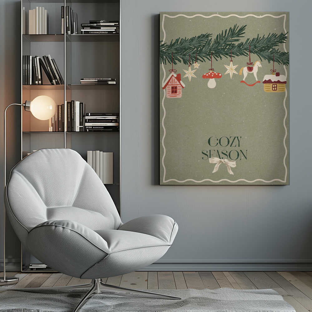 A vintage-style holiday poster with a sage green background. A pine branch hangs at the top, decorated with illustrated ornaments including houses, stars, a mushroom, and a rocking horse. Below, the text 'COZY SEASON' is written in a dark serif font with a light-colored bow underneath. Artwork
