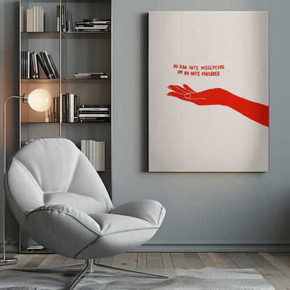 A minimalist poster with a cream background in a black frame. It features a stylized red illustration of an outstretched hand, palm up. Above the hand, red text in a casual font reads 'DU KAN INTE MISSLYCKAS OM DU INTE FÖRSÖKER,' which is Swedish for 'You can't fail if you don't try.' Poster