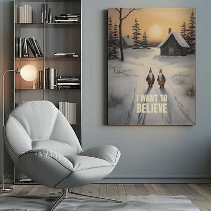 A vertical painting of a snowy winter scene with two gnomes walking away from the viewer on a path. The gnomes have long white beards and red hats. In the distance are snow-covered cabins and pine trees under an orange sunset sky. The words 'I WANT TO BELIEVE' are written in large, bold letters in the foreground. Print