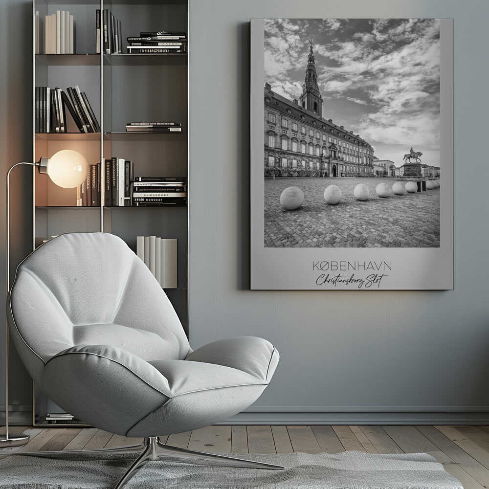 A black and white travel poster of Christiansborg Palace in Copenhagen, Denmark. The image shows the grand building and its tower against a dramatic cloudy sky, with a cobblestone square, stone bollards, and an equestrian statue in the foreground. Text at the bottom identifies the location. Decor