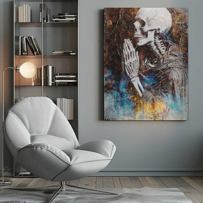 A mixed media artwork of a skeleton from the chest up, in profile, with its hands clasped together in prayer. The background is a heavily textured and cracked dark brown, with abstract splashes of blue and fiery yellow, particularly at the bottom. Wall Art