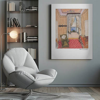 A framed print of a painting by Henri Matisse. The artwork depicts an interior room scene with peach-colored walls, a vibrant pink and red patterned rug, and an armchair. An open window with lace curtains offers a view of the blue sea. Decor