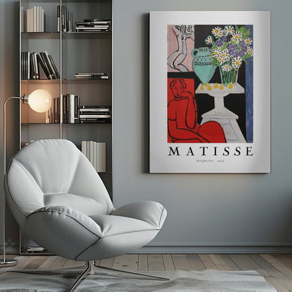 A framed art poster of Henri Matisse's painting 'Margherite' from 1939. The vibrant Fauvist artwork depicts a woman in a bold red dress, a still life with a turquoise vase of daisies on a white table, and a small sketch of a nude in the background. The artist's name is printed below the image. Poster