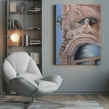 A pastel drawing of an ornate architectural detail on a building facade, featuring elaborate carvings above an arched window. The carvings depict classical female figures in flowing drapery, rendered in warm pink and brown tones against a light blue sky. A vintage-style street lamp is visible to the left. Wall Art