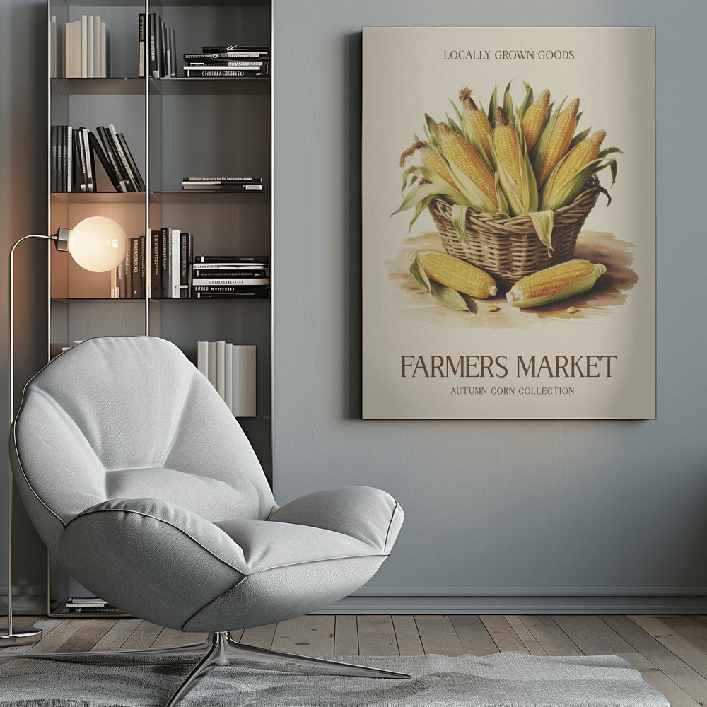 A vintage-style art print with a black frame featuring a wicker basket full of ears of corn. The poster has text that reads 'LOCALLY GROWN GOODS' at the top and 'FARMERS MARKET AUTUMN CORN COLLECTION' at the bottom. The background is a light cream color. Artwork