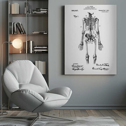 A framed black and white print of a vintage patent illustration for an anatomical skeleton by C.E. Fleck, patented February 7, 1911. The detailed drawing shows a full human skeleton from an anterior view with parts labeled with numbers, set against a light background with official patent text and signatures. Artwork