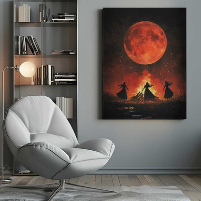 A dramatic painting of three silhouetted women in long dresses dancing around a large bonfire at night. Above them, a massive, textured, blood-red full moon hangs in a dark sky filled with embers and stars. Print