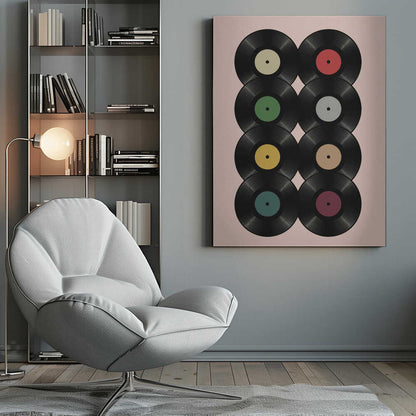 A graphic art print featuring eight black vinyl records arranged in two columns of four against a pale pink background. Each record has a different solid-colored label, creating a colorful and retro pattern. The artwork is enclosed in a simple black frame. Artwork