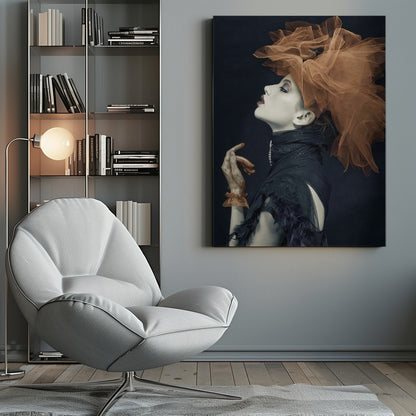 A dramatic profile portrait of a woman with pale skin against a black background, looking up. She wears an extravagant, voluminous orange tulle headpiece, a high-collared black feathered dress, and a matching orange glove. Poster