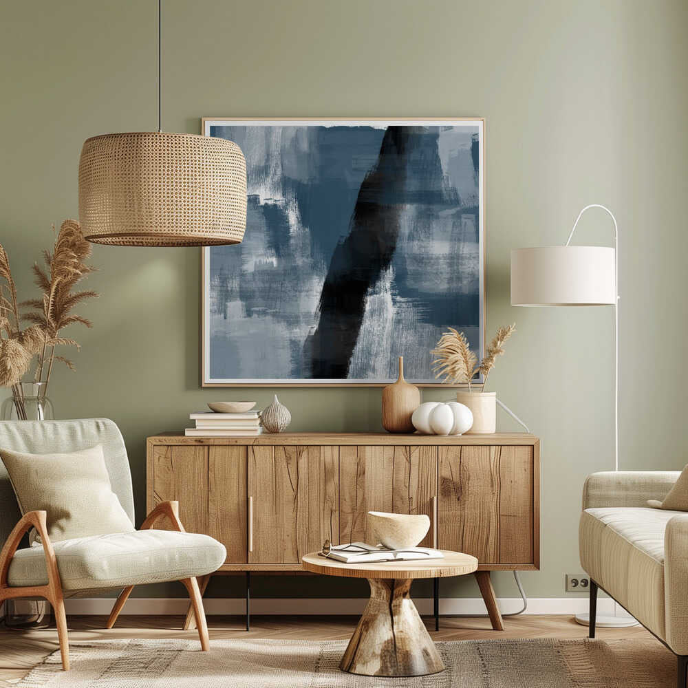 Abstract painting with bold blue, grey, and black brushstrokes in a light wood frame.