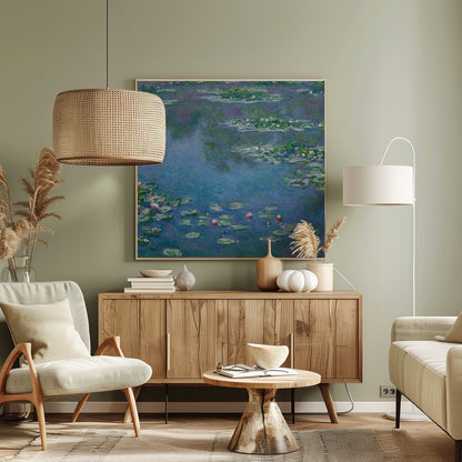An Impressionist painting by Claude Monet depicting a serene water lily pond. The canvas is filled with cool blue and purple water reflecting the sky, dotted with green lily pads and occasional pink and white water lily blossoms. The artwork is presented in a light wood frame. Artwork