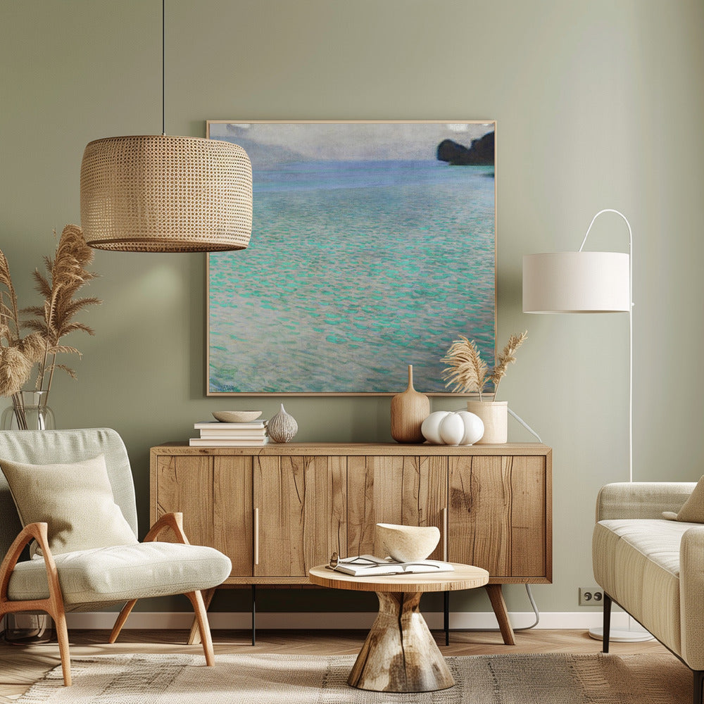 An impressionist painting by Gustav Klimt, in a light wood frame, depicting a serene body of water. The surface shimmers with countless dabs of bright turquoise and light blue paint, creating a textured, sparkling effect. In the distance, a hazy shoreline sits under a muted, overcast sky. Decor