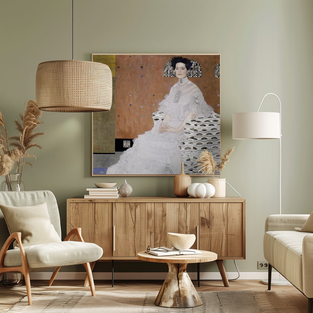 A framed print of Gustav Klimt's 'Portrait of Fritza Riedler'. A woman with dark upswept hair wearing a flowing white gown sits in a patterned armchair against a geometric, earth-toned background. Decor