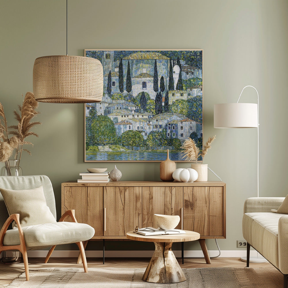 A framed art print of Gustav Klimt's 'Church in Cassone,' featuring a dense, colorful depiction of a hillside village by a lake. The scene is filled with white-walled houses, tall cypress trees, and lush greenery, all painted in a distinctive, textured, mosaic-like style with dominant blues, greens, and yellows. Decor