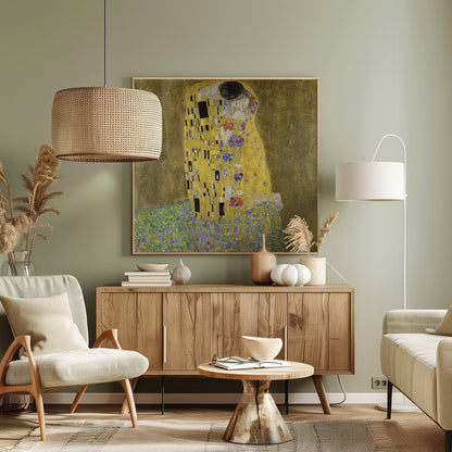 A framed print of Gustav Klimt's famous painting, 'The Kiss'. It features a couple in a passionate embrace, adorned in ornate, patterned golden robes. They are kneeling on a vibrant bed of flowers against a shimmering, textured gold background. Print