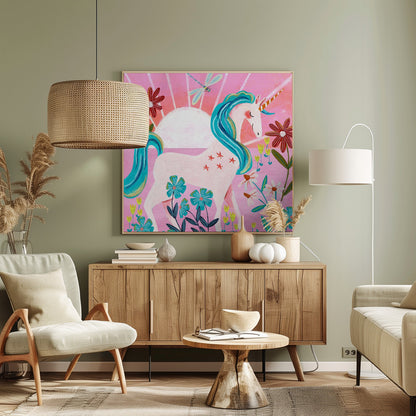 A whimsical painting of a serene white unicorn with a vibrant blue mane and tail, standing in a field of colorful flowers. The background features a large white sun against a pink sky with a dragonfly flying overhead. The artwork is presented in a light wood frame. Print
