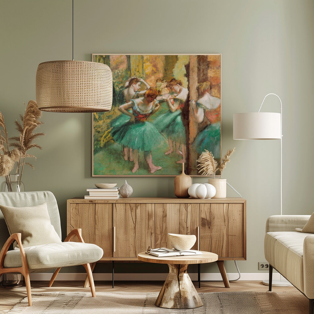 An impressionist painting of four ballet dancers in green tutus backstage. The dancers are adjusting their costumes and hair against a warm, painterly background of yellow, orange, and brown tones. The artwork is displayed in a light wood frame. Wall Art