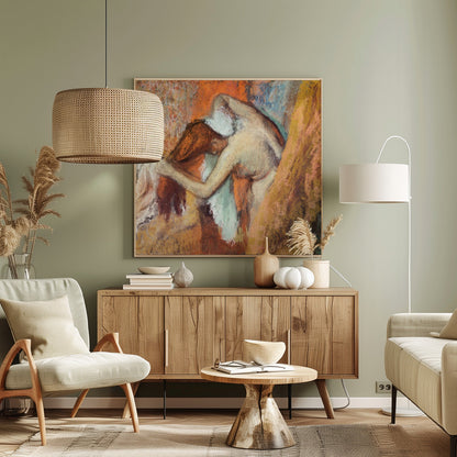 A framed impressionist pastel drawing by Edgar Degas showing a nude woman from the back, bending over to dry her neck with a towel. The artwork is characterized by its warm color palette of oranges, browns, and yellows, with textured, visible strokes. Decor