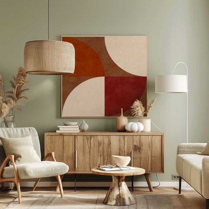 A framed abstract artwork featuring a four-quadrant design with curved geometric shapes. The colors are warm earth tones, including rust orange, deep red, brown, and cream, arranged to form interlocking semi-circles against a textured background. Decor