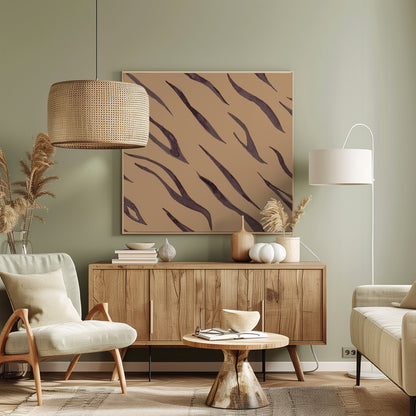 A framed piece of art featuring an abstract pattern of dark, purplish-brown tiger stripes painted in a watercolor style, arranged diagonally on a solid tan background, all enclosed within a light wood frame. Decor