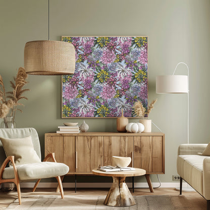 A framed artwork displaying a dense, repeating floral pattern with detailed illustrations of pink, purple, blue, white, and yellow flowers on a light blue background, encased in a simple light wood frame. Decor