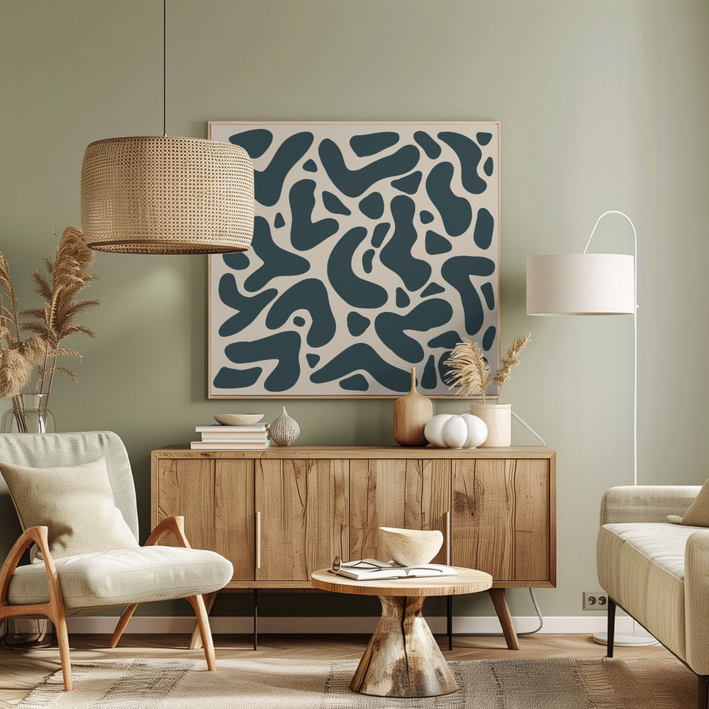 A square abstract art print in a light wood frame, showcasing a pattern of dark teal, amoeba-like shapes scattered on a light beige background. Print