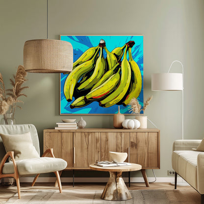 A vibrant pop art illustration of a large bunch of yellow-green bananas against a bright, textured blue background, all enclosed in a simple light wood frame. Decor