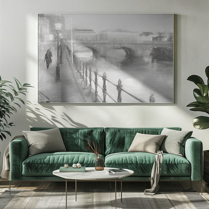A framed, black and white impressionistic artwork of a city scene on a foggy or rainy day. In the foreground, a dark metal railing runs along a riverside walkway where a person in a dark coat is walking. An arched stone bridge crosses the river in the midground, with hazy buildings visible in the background, creating a moody and atmospheric scene. Wall Art