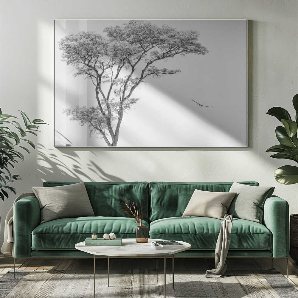 Black and white photograph of a large tree with a single bird flying against a light sky, nature wall art.