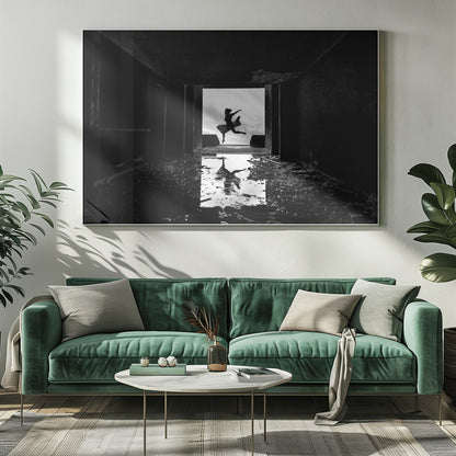 A dramatic black and white photo of a silhouetted dancer leaping in a bright doorway, viewed from inside a dark, derelict building. The dancer's reflection is captured in a puddle on the rubble-strewn floor. Poster