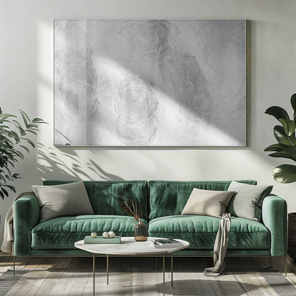 Abstract art with soft, cloud-like shapes in shades of grey and white, set in a silver frame.
