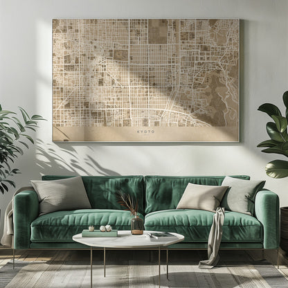 A framed, stylized map of Kyoto, Japan, in shades of brown and beige. The city streets are illustrated as a complex grid of off-white lines against a textured brown background. At the bottom, a solid beige banner contains the text 'KYOTO' and 'JAPAN' in a modern sans-serif font. The artwork is surrounded by a brushed silver frame. Artwork