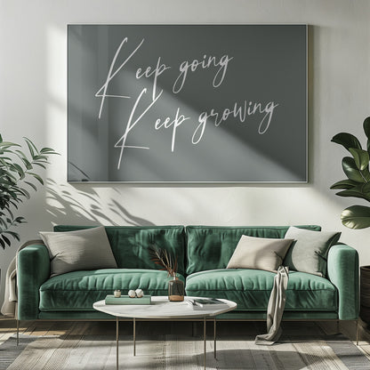 A motivational art piece featuring the words 'Keep going' and 'Keep growing' in a delicate white script on a muted sage green background, set within a simple silver frame. Print